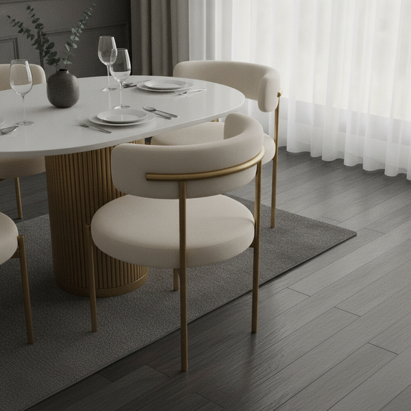 Four cream upholstered dining chairs with ergonomic curves around a sleek oval timber tabletop, subtly lit, in a sophisticate